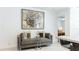 Cozy seating area with neutral tones and modern decor, next to the kitchen area, brings a touch of style to the space at 526 Bird Key Dr, Sarasota, FL 34236