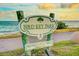 A beautiful park sign stands near the ocean, inviting visitors to Bird Key Park at 526 Bird Key Dr, Sarasota, FL 34236