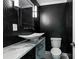 Stylish powder room featuring geometric wallpaper, unique sink, and modern lighting at 526 Bird Key Dr, Sarasota, FL 34236