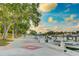 A stunning waterfront view with boat docks surrounded by lush green trees and blue skies at 526 Bird Key Dr, Sarasota, FL 34236