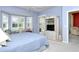 This spacious primary bedroom is accented by multiple windows and a calming color palette at 5283 Chase Oaks Dr, Sarasota, FL 34241