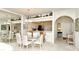 Cozy dining room with a glass table, bar seating, and stylish decor at 5283 Chase Oaks Dr, Sarasota, FL 34241