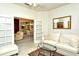 Bright, comfortable living room with a view to the dining area and a white sofa and glass table at 5283 Chase Oaks Dr, Sarasota, FL 34241
