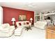 Welcoming living room with neutral carpet, and access to the dining and kitchen areas at 5283 Chase Oaks Dr, Sarasota, FL 34241