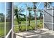 Screened in patio shows the yard at 5283 Chase Oaks Dr, Sarasota, FL 34241