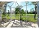 Screened in patio shows the yard at 5283 Chase Oaks Dr, Sarasota, FL 34241