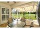 A screened lanai with golf course views and a retractable awning offers an ideal outdoor space at 5283 Chase Oaks Dr, Sarasota, FL 34241