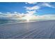 Expansive white sand beach featuring beautiful water and a view of the horizon at 535 Sanctuary Dr # A202, Longboat Key, FL 34228