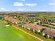 Gorgeous aerial view of the condo building overlooking golf course, water and landscaping at 5537 Palmer Cir # 205, Lakewood Ranch, FL 34211