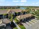 Elevated view of the condos showcasing attached garages, lush landscaping and golf course at 5537 Palmer Cir # 205, Lakewood Ranch, FL 34211