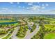 Wide aerial view of Lakewood National entrance, showcasing the community layout with golf course and landscaping at 5537 Palmer Cir # 205, Lakewood Ranch, FL 34211