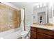 Bathroom featuring a shower, toilet, granite countertop, and dark wood vanity at 5537 Palmer Cir # 205, Lakewood Ranch, FL 34211