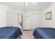 Bedroom featuring two beds, closet and dresser at 5537 Palmer Cir # 205, Lakewood Ranch, FL 34211