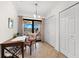 Bright dining area featuring a sliding door to balcony and closet at 5537 Palmer Cir # 205, Lakewood Ranch, FL 34211