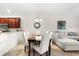 Dining room with seating for six next to the living room and kitchen at 5537 Palmer Cir # 205, Lakewood Ranch, FL 34211