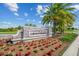 Beautifully landscaped entrance sign for Lakewood National, surrounded by colorful flowers and lush greenery at 5537 Palmer Cir # 205, Lakewood Ranch, FL 34211