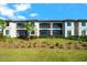 Exterior view of the condo showcasing the balconies, landscaping and architecture of this lovely property at 5537 Palmer Cir # 205, Lakewood Ranch, FL 34211