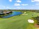 Scenic view of the golf course with lake and sand traps in a beautiful gated community at 5537 Palmer Cir # 205, Lakewood Ranch, FL 34211
