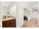 Hallway with granite-topped serving area and view of the dining area at 5537 Palmer Cir # 205, Lakewood Ranch, FL 34211