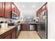 Well-equipped kitchen featuring stainless steel appliances and granite countertops at 5537 Palmer Cir # 205, Lakewood Ranch, FL 34211
