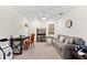 Living Room showing a fan, sofa, desk, chair and shelf with many home decorations at 5537 Palmer Cir # 205, Lakewood Ranch, FL 34211