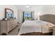 Bright main bedroom featuring a ceiling fan, furnishings and a sunny window view at 5537 Palmer Cir # 205, Lakewood Ranch, FL 34211