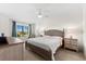 Bright main bedroom featuring a ceiling fan, furnishings and a sunny window view at 5537 Palmer Cir # 205, Lakewood Ranch, FL 34211