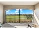 Scenic patio featuring comfortable seating and expansive golf course and community views at 5537 Palmer Cir # 205, Lakewood Ranch, FL 34211