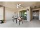 Cozy screened porch with table and chairs, perfect for outdoor relaxation and dining at 5537 Palmer Cir # 205, Lakewood Ranch, FL 34211
