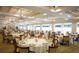 Expansive ballroom featuring set tables, large windows, and elegant decor, suited for special occasions at 5712 Cottonwood St, Bradenton, FL 34203