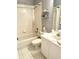 Clean bathroom features a tub/shower combo, white tile, and updated vanity at 5712 Cottonwood St, Bradenton, FL 34203