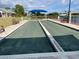 A pair of bocce ball courts shaded by awnings at 5712 Cottonwood St, Bradenton, FL 34203
