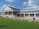 Stately clubhouse with covered portico, brick facade, and manicured lawn at 5712 Cottonwood St, Bradenton, FL 34203