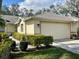 Charming one-story home featuring manicured landscaping and an attached two-car garage at 5712 Cottonwood St, Bradenton, FL 34203