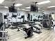 Spacious gym featuring modern exercise equipment, ample mirrors, and mounted TVs at 5712 Cottonwood St, Bradenton, FL 34203