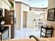 Bright kitchen featuring white tile floors and appliances and an adjacent breakfast nook at 5712 Cottonwood St, Bradenton, FL 34203