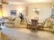 Open-plan living areas with a plush sofa, dining table, and access to the kitchen bar at 5712 Cottonwood St, Bradenton, FL 34203