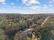 Expansive aerial shot of the community, showcasing mature trees and a glimpse of the waterfront at 604 68Th Avenue W Dr, Bradenton, FL 34207