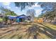 Spacious backyard with patio area and shade, enclosed by a wood fence at 604 68Th Avenue W Dr, Bradenton, FL 34207