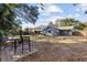 Large backyard features a patio, wooden fence, and mature trees at 604 68Th Avenue W Dr, Bradenton, FL 34207