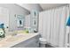 Bright bathroom featuring a vanity with ample counter space and a shower with star-themed curtain at 604 68Th Avenue W Dr, Bradenton, FL 34207