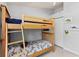Bedroom with bunkbeds, closet, and ceiling fan at 604 68Th Avenue W Dr, Bradenton, FL 34207
