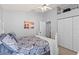 Bedroom with double closets, ensuite bathroom, and ceiling fan at 604 68Th Avenue W Dr, Bradenton, FL 34207