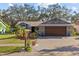 Charming single-story home with a two-car garage and large brick driveway at 604 68Th Avenue W Dr, Bradenton, FL 34207