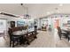 Open-concept living area with dining table and breakfast bar at 604 68Th Avenue W Dr, Bradenton, FL 34207