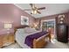 Comfortable main bedroom with ceiling fan, sliding glass doors to the pool, and a Centurion safe at 604 68Th Avenue W Dr, Bradenton, FL 34207