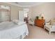 Bright main bedroom offering natural light, neutral tones, and access to the main bath at 6930 Mystic Ln, Sarasota, FL 34243