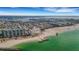 Beautiful aerial view of a beachfront condo complex with direct access to the shoreline and beaches at 7000 Beach Plz # 905, St Pete Beach, FL 33706