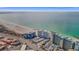 Beautiful aerial view of a beachfront condo and complex along the coast with the ocean nearby at 7000 Beach Plz # 905, St Pete Beach, FL 33706