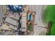 Overhead view of beachfront condo complex with pool, shuffleboard, parking, and beach access at 7000 Beach Plz # 905, St Pete Beach, FL 33706